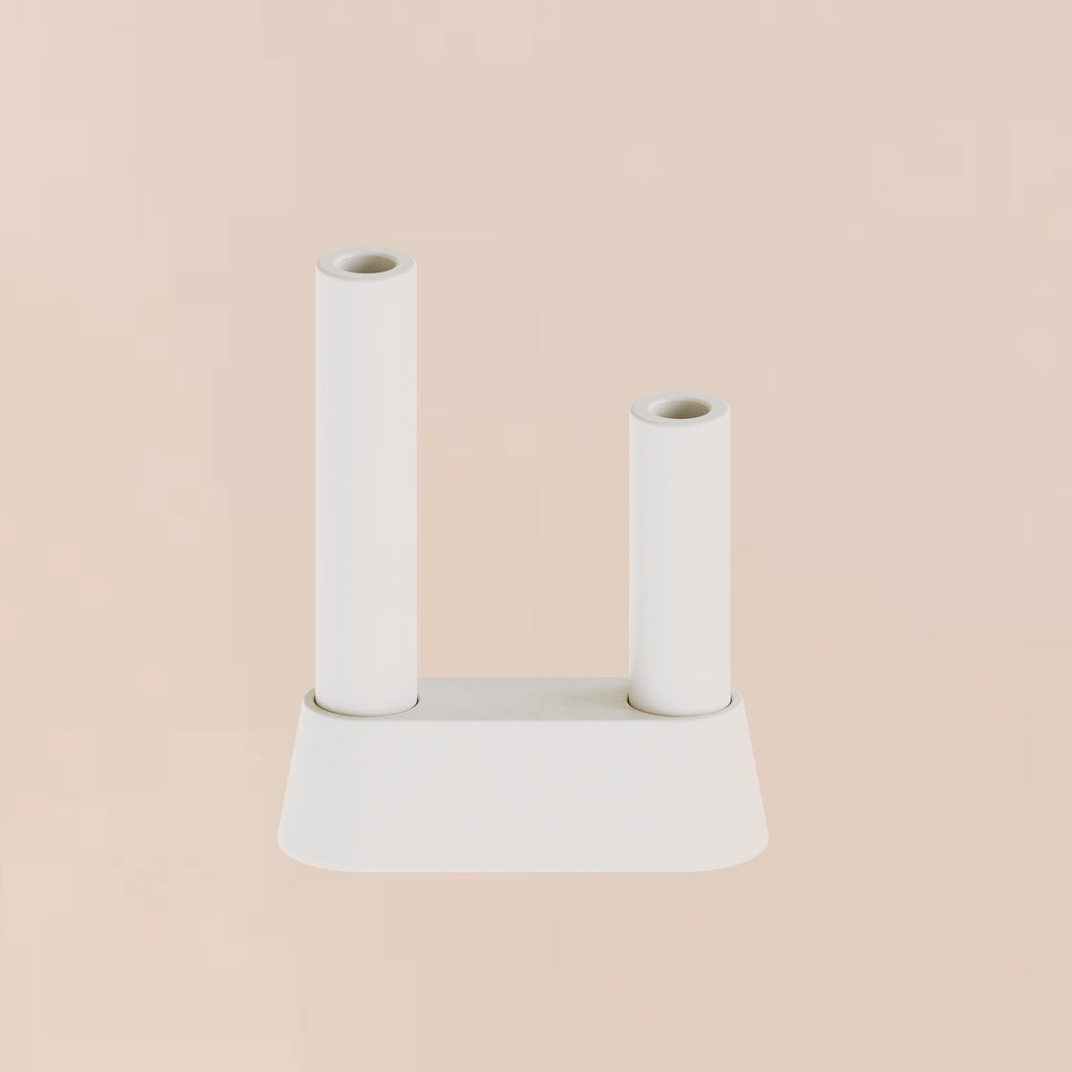 CAST sculptural plaster double pillar candle holder with low chamfered base styled as a minimalist homeware object on a soft backdrop