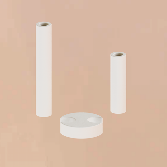 Handmade minimalist plaster double pillar candle holder showing its disassembled cylindrical columns and unique curved moon base component