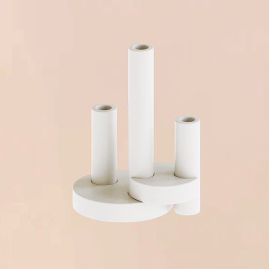 Editions17 CAST sculptural plaster candle holder moon base assemblage styled as a premium architectural statement piece on a minimalist peach backdrop
