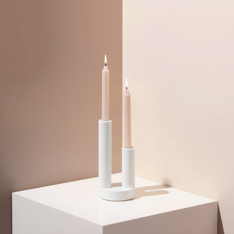 Architectural double pillar plaster candle holder featuring artisanal craftsmanship for luxury Christmas gift ideas and high-end minimalist interior design tablescape styling.